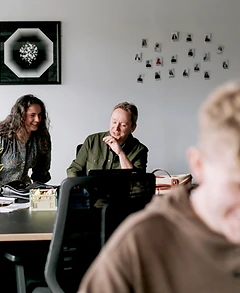 Two team members collaborating in office