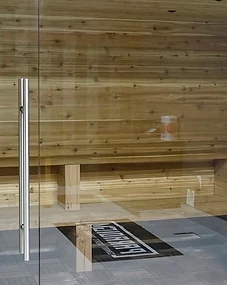 Paradigm® recovery room — cedar sauna behind glass door