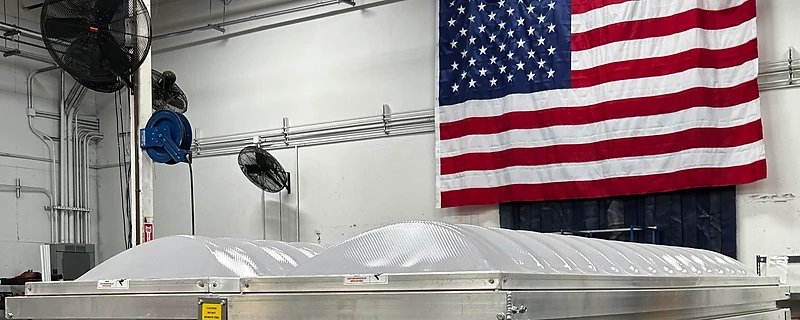 Prismatic skylight unit on a workbench inside the Sunoptics manufacturing facility