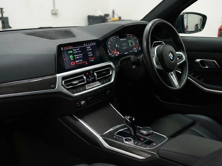 Right-hand drive UK BMW dashboard showing condition based service icons — BMW specialist JVS Telford