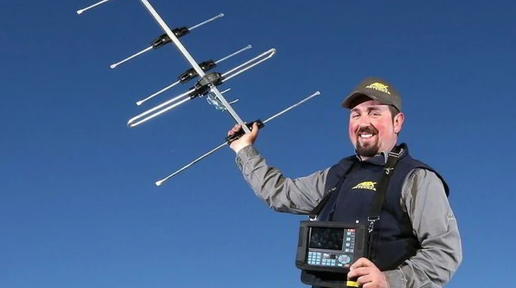 Zane from ABX Electronics Antennas holding a TV antenna and field strength meter in Albury Wodonga