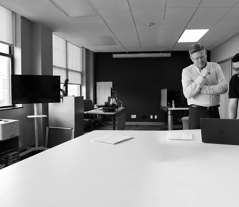 Moss Strategy team collaborating with a client across a conference table