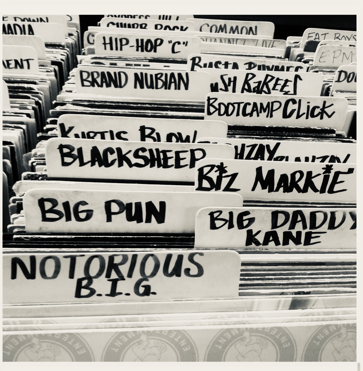 Crate of vinyl records with handwritten tabbed dividers — Notorious B.I.G., Big Pun, Big Daddy Kane, Biz Markie, Kurtis Blow and more