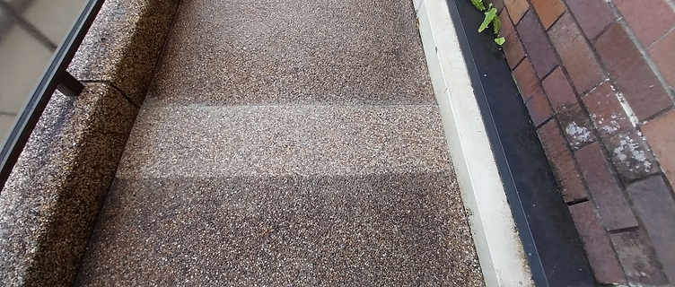 The same walkway strip re-finished with new pebblecrete, smooth and level