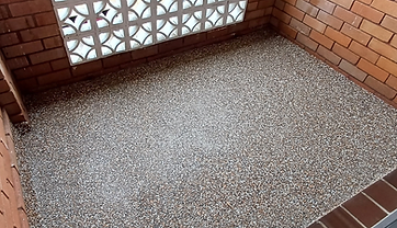 Finished exposed aggregate pebble floor in a residential courtyard