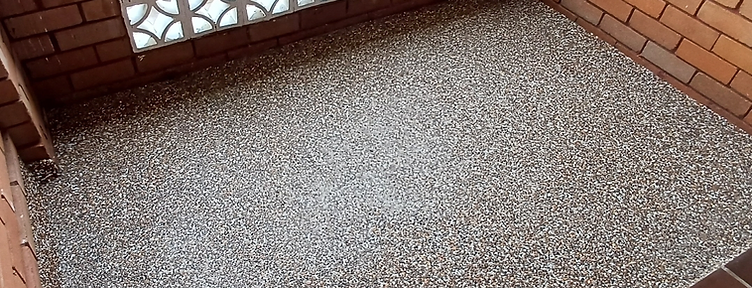 Finished exposed aggregate pebble surface in a residential courtyard