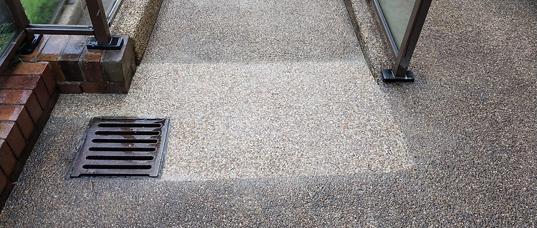Close-up of the finished patch with new aggregate blending into the existing path