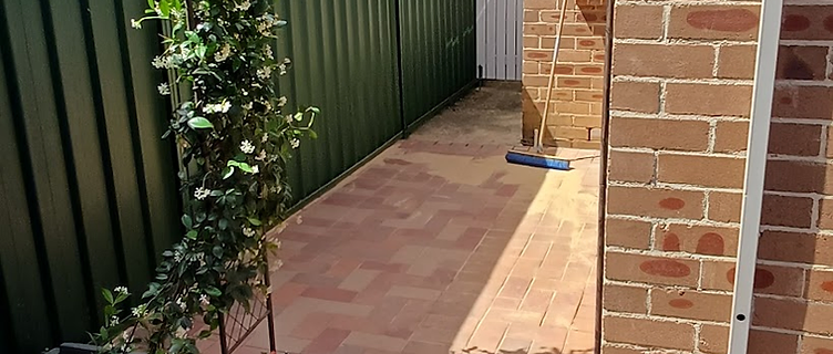 Completed herringbone brick paving side path