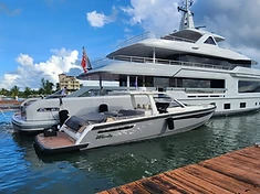 Yacht & tender dockside at the marina