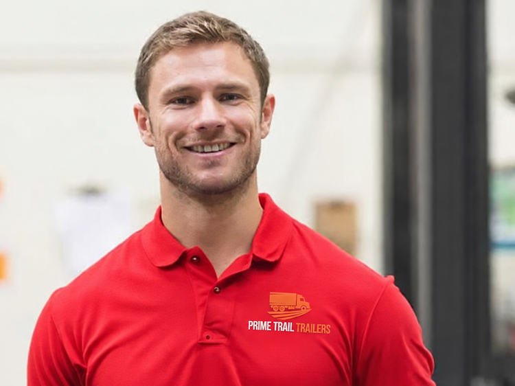Prime Trail Trailers service team member in the shop wearing a branded polo shirt