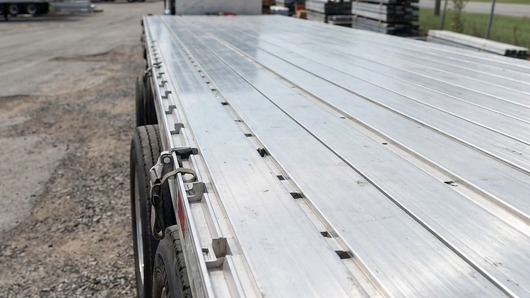 Extruded aluminum decking on a commercial flatbed trailer