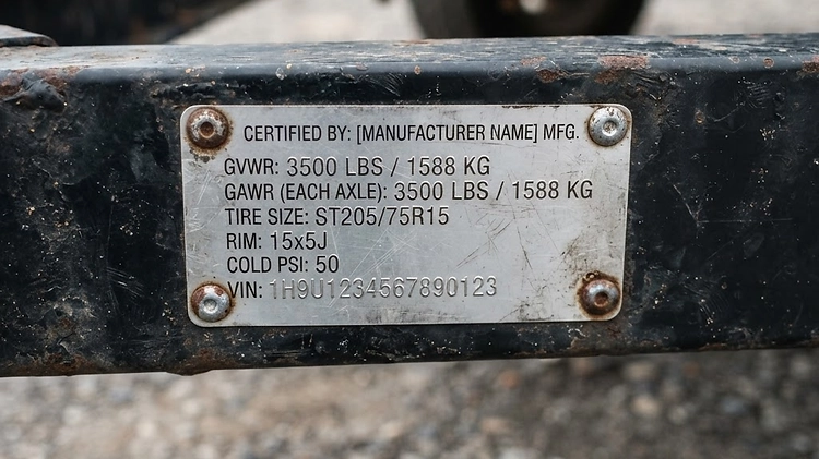 Trailer VIN and GVWR Sticker Close up of a trailer VIN sticker showing GVWR and GAWR ratings