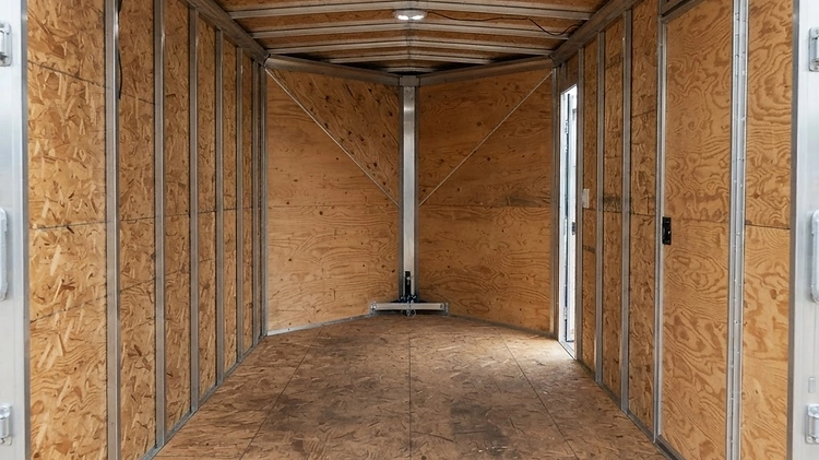The interior of a V-nose enclosed trailer showing the extra space at the front.