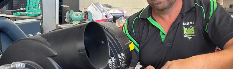 Emerald Air Compressors technician servicing commercial air compressor equipment