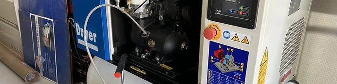 Air compressor servicing equipment during commercial compressor maintenance
