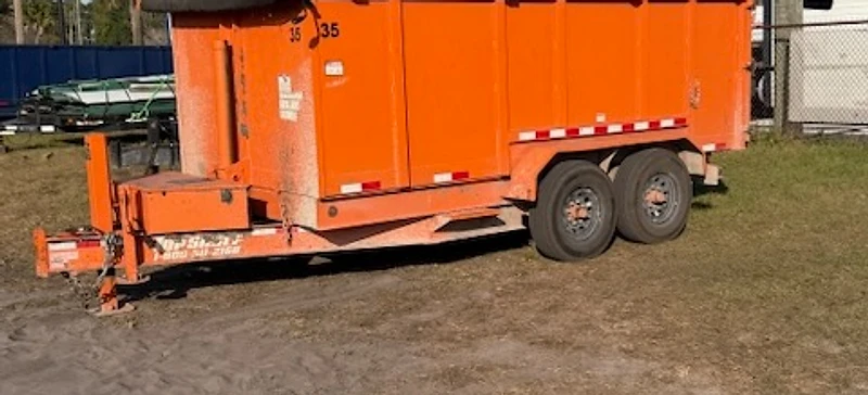 Junkez orange roll-off dumpster ready for delivery in Northeast Florida