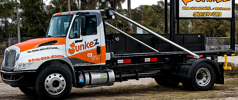 Junkez dumpster truck ready for junk removal in Jacksonville