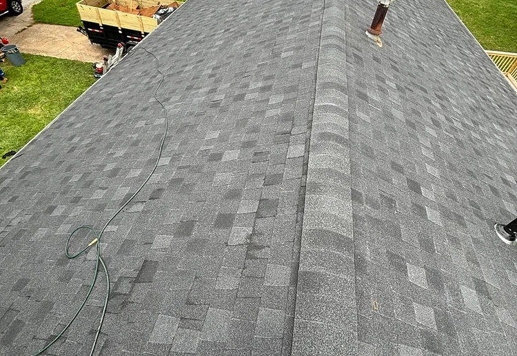 Completed roof replacement by Top Dog Contracting, backed by a 10-year workmanship warranty