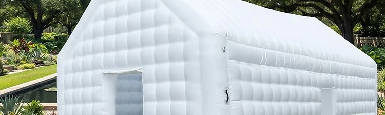 Illustration of a white inflatable wedding pavilion with quilted chambers on a manicured lawn