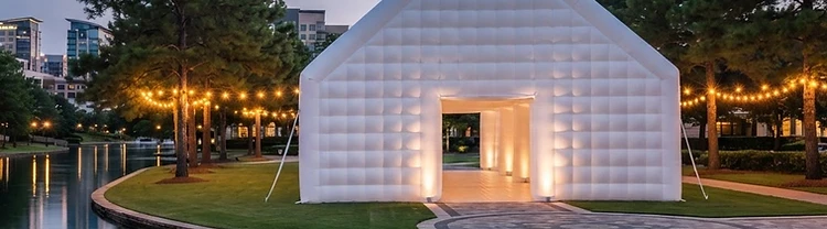 Illustration of a larger white inflatable wedding pavilion glowing at twilight