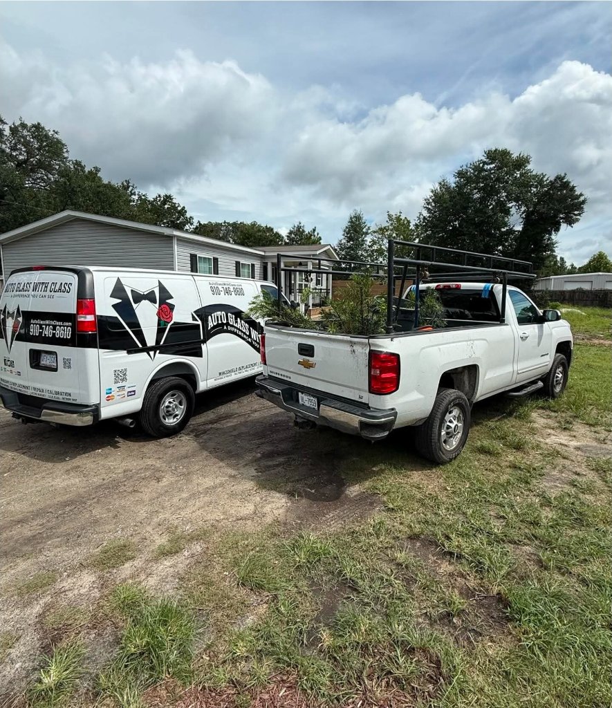 Auto Glass With Class mobile service van and pickup truck parked at a job site
