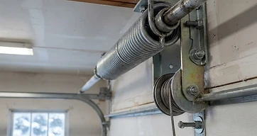 Why Cleveland Garage Door Springs Snap in the Cold — and How to Prevent It
