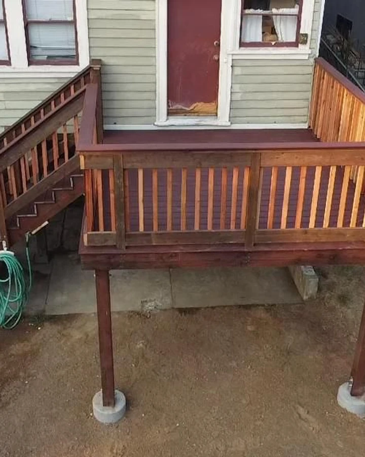 Completed elevated deck and staircase built by D Global Construction