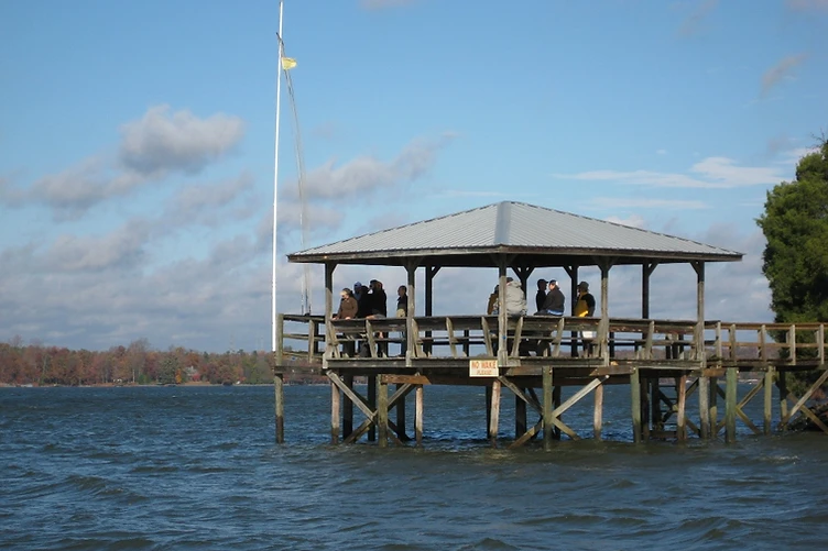 The CYC boathouse with racked rowing shells beside the clubhouse