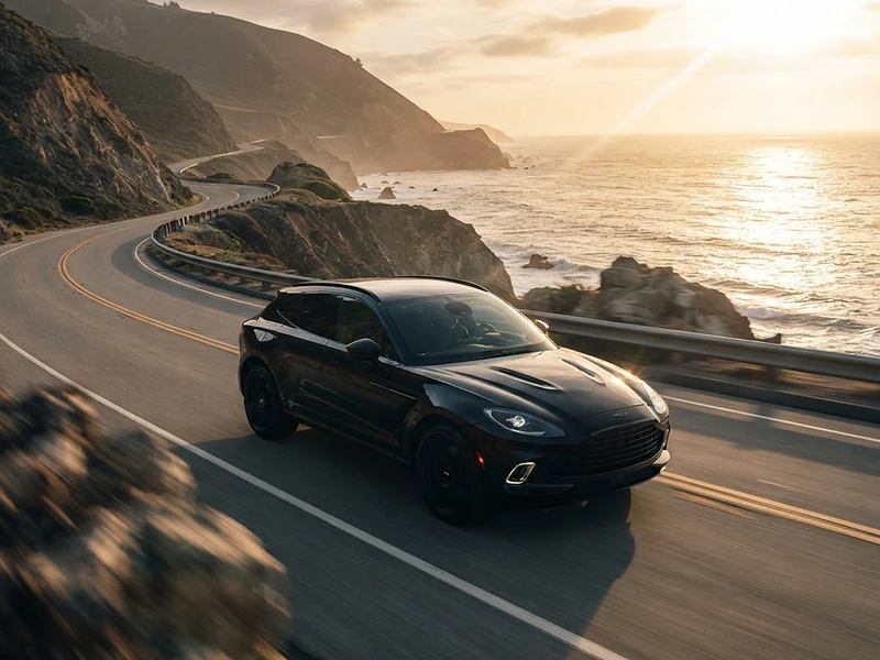 Cinematic automotive commercial — luxury SUV on a coastal highway