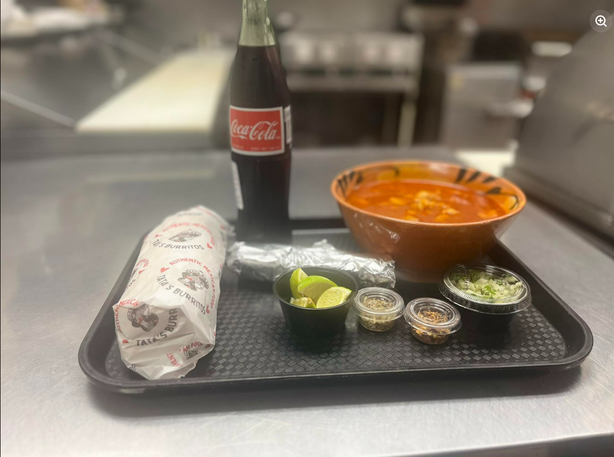 Tata's burrito with rice, beans, and sides