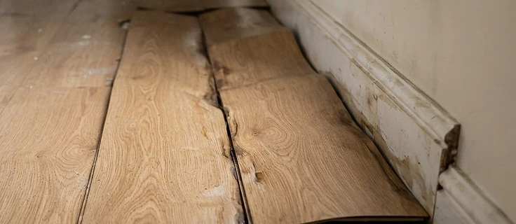 Warped flooring caused by standing water damage
