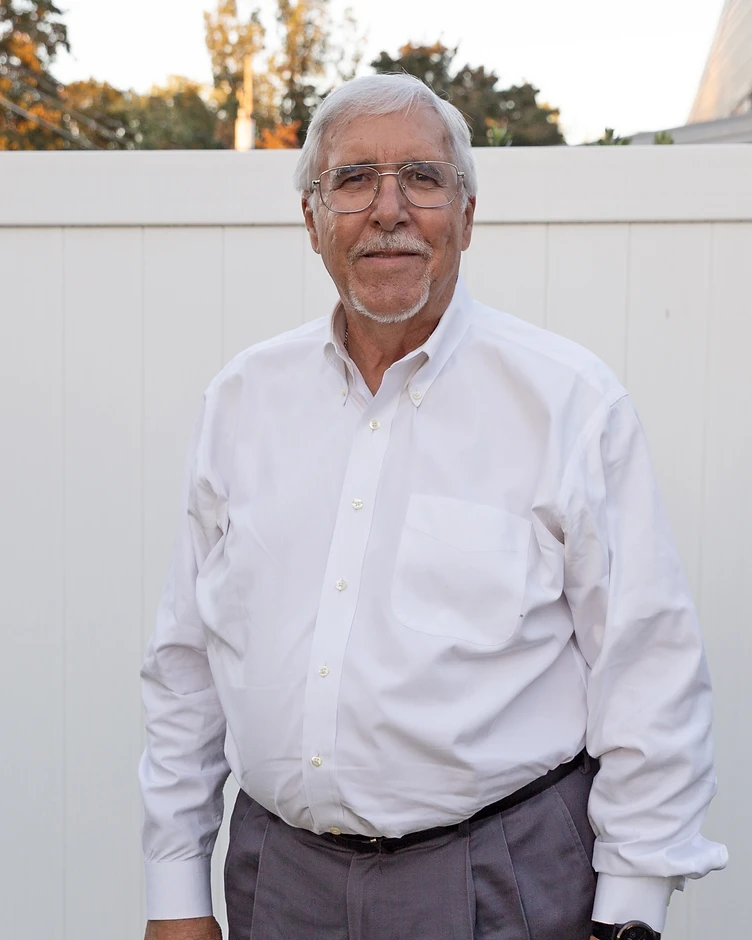 Dr. James Hamer, debt strategist, in his sunlit office