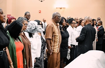 Congregation standing together in prayer