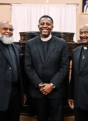 Church leaders standing together on stage before service