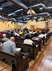Congregation gathered in worship looking toward the pulpit