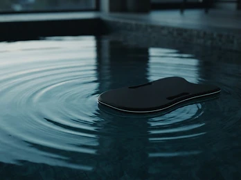 FlowSense concept floating in calm water with gentle ripples
