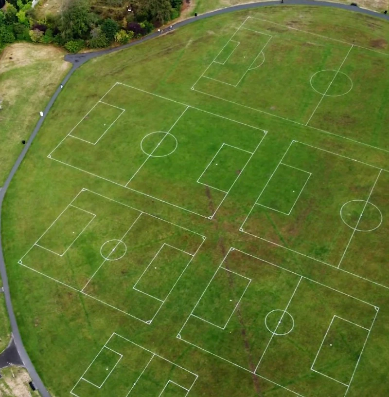 Robotic GPS line-marking machine on a North Yorkshire sports field