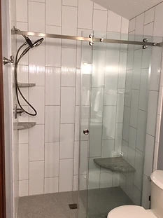 Glass Door Tile Shower Renovation in Sun City Center, FL