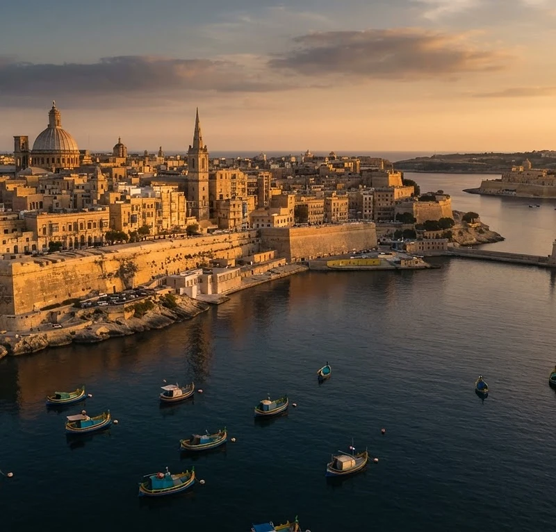 Golden-hour aerial view of Valletta's Grand Harbour