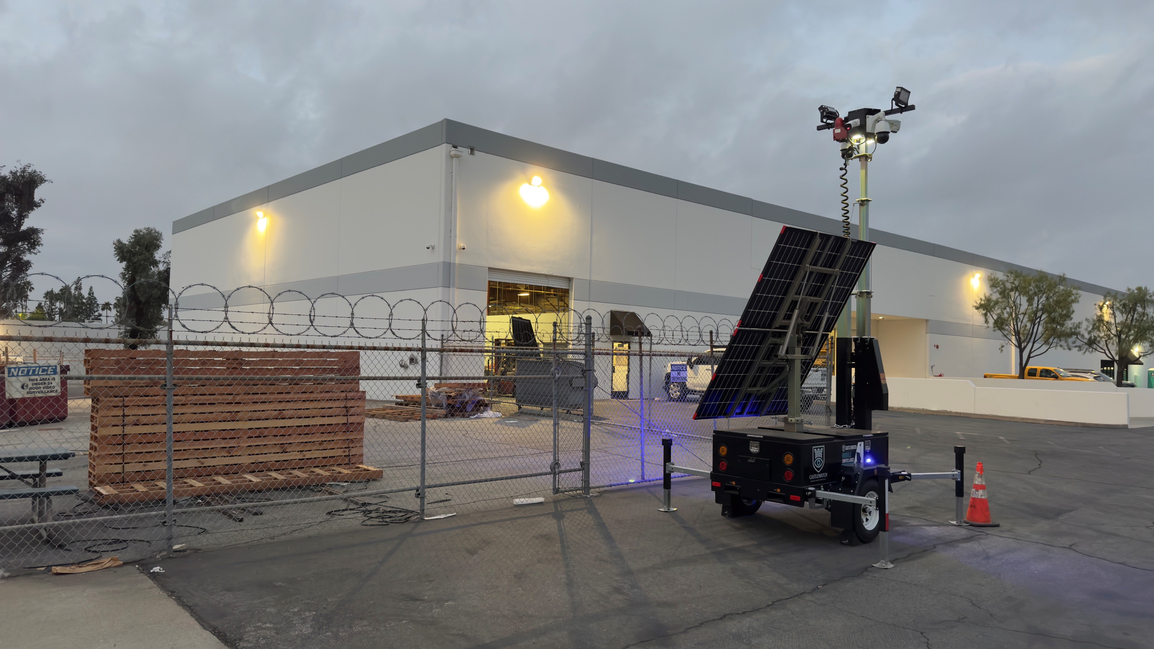 Mobile solar security trailer deployed at a Southern California construction site at twilight