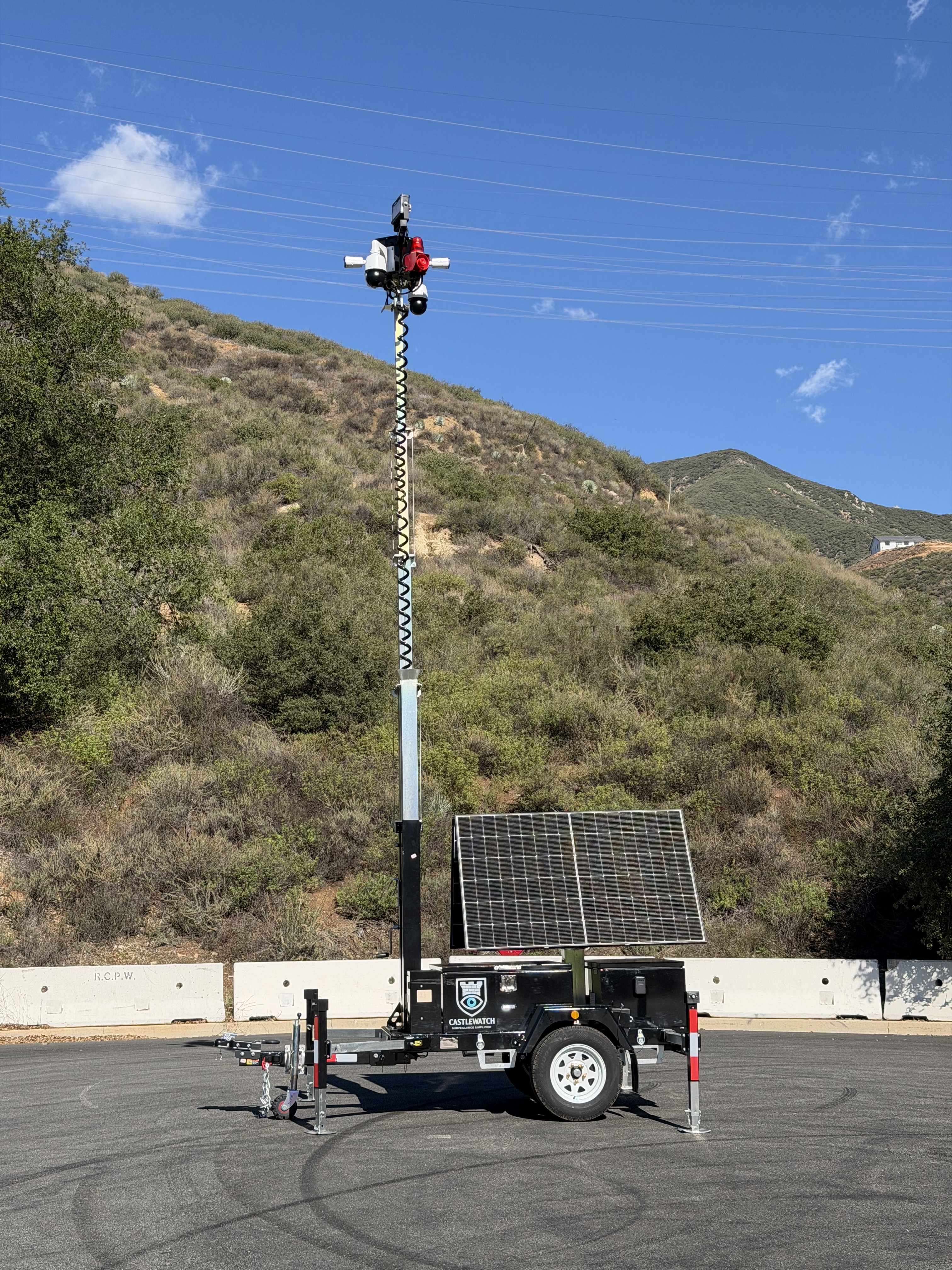 Mobile solar security trailer deployed at a Southern California construction site at twilight