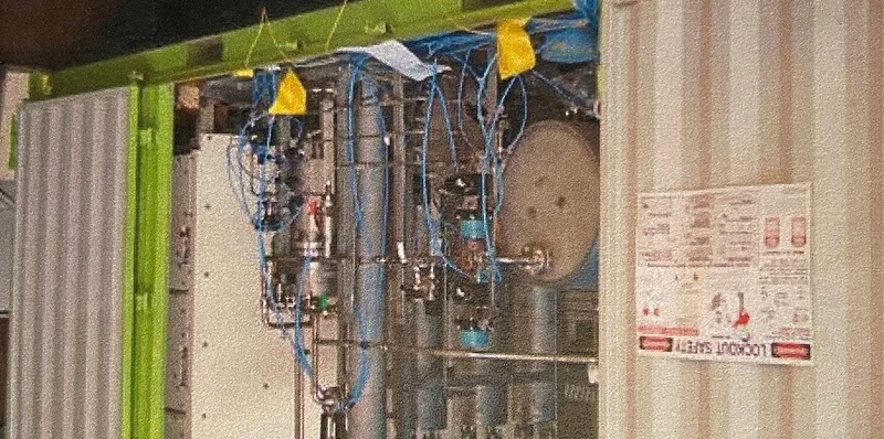 Containerised AEI production system with pipework and valves