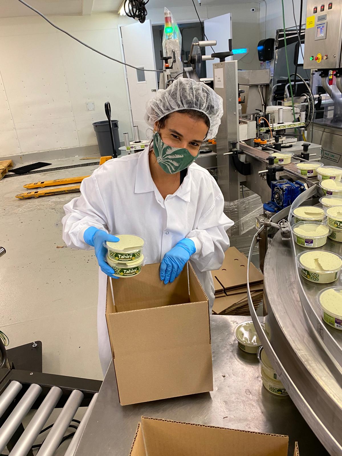 Tal packing Tal's Mediterranean products in the production facility