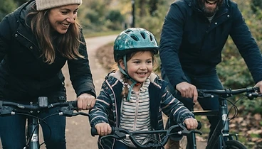 Family riding bikes together