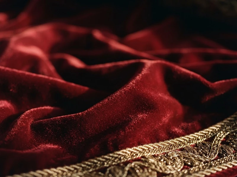 Luxury red velvet detail with warm studio lighting