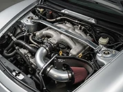 Engine bay detail before the show — intake and strut brace went on this weekend.