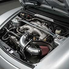 Engine bay detail before the show — intake and strut brace went on this weekend.