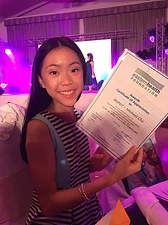 Michael Honsue Cho's firstborn daughter holding an Eastern Health Foundation Certificate of Appreciation at the 2017 A Night of Heartfelt Love fundraiser