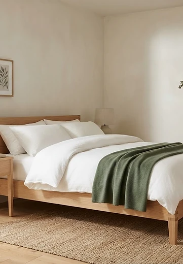Furniture inspiration: a tidy oak bed and nightstand in a light-filled bedroom