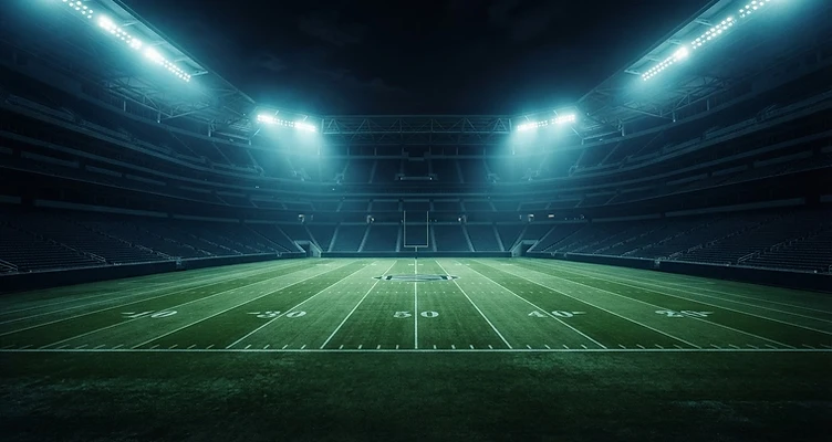 Stadium lights glowing over a football field at night